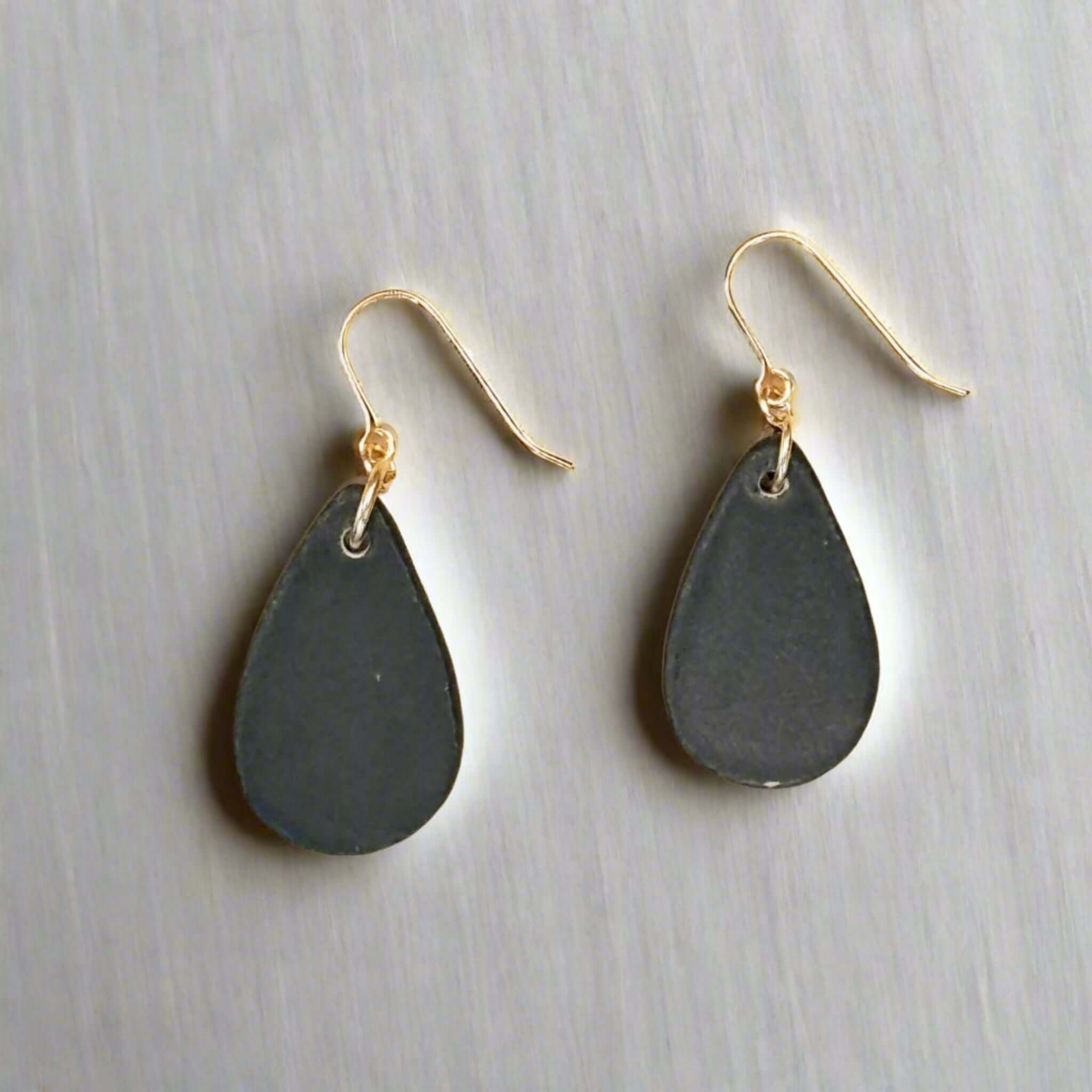 back view black teardrop earring with gold ear wire