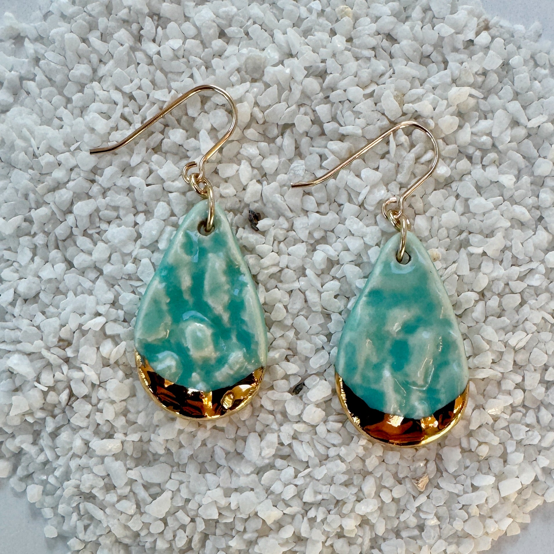 teardrop shaped, aqua color porcelain earrings with lace texture and gold ear wires