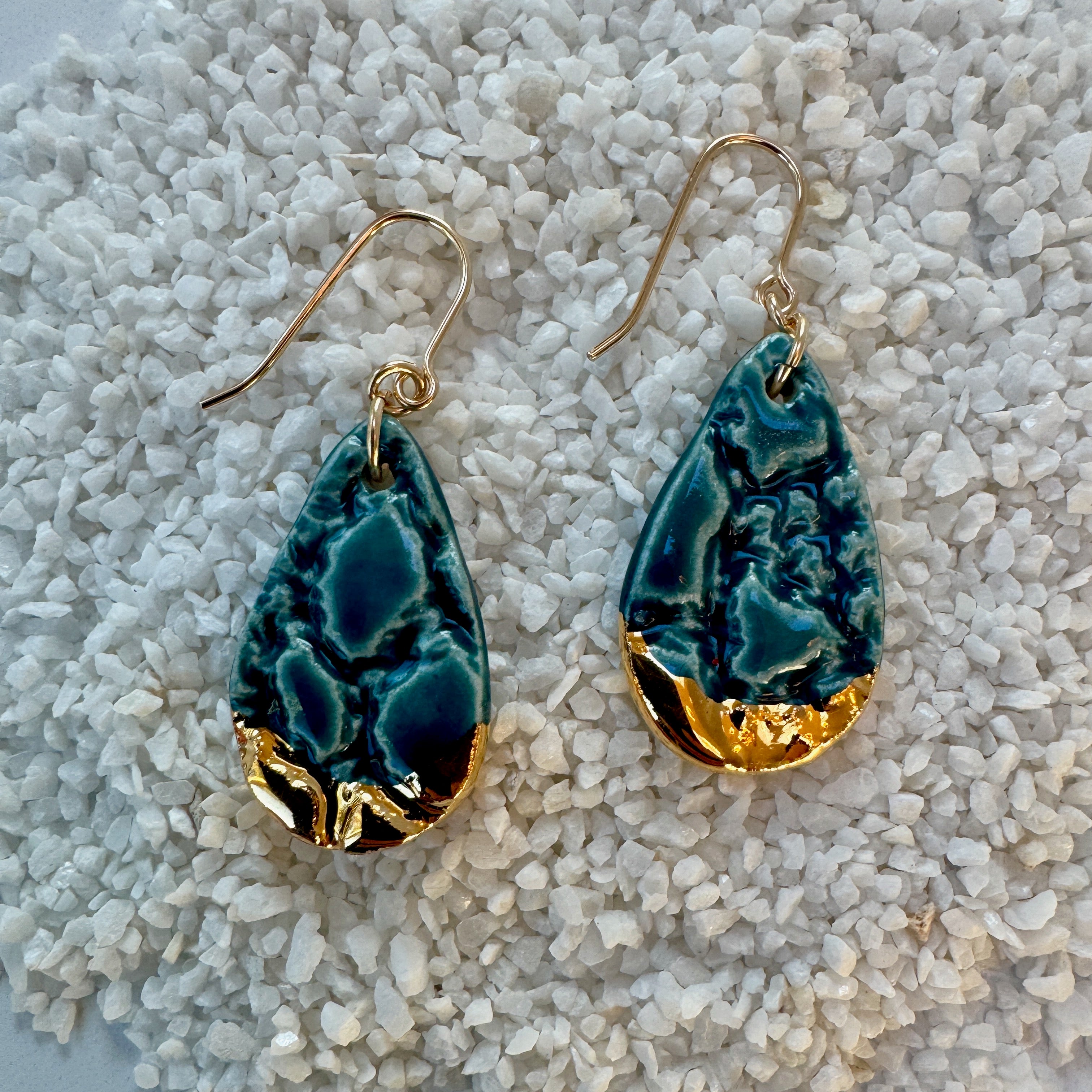 teardrop shaped, teal color porcelain earrings with lace texture and gold ear wires