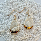 teardrop shaped, white color porcelain earrings with lace texture and gold ear wires