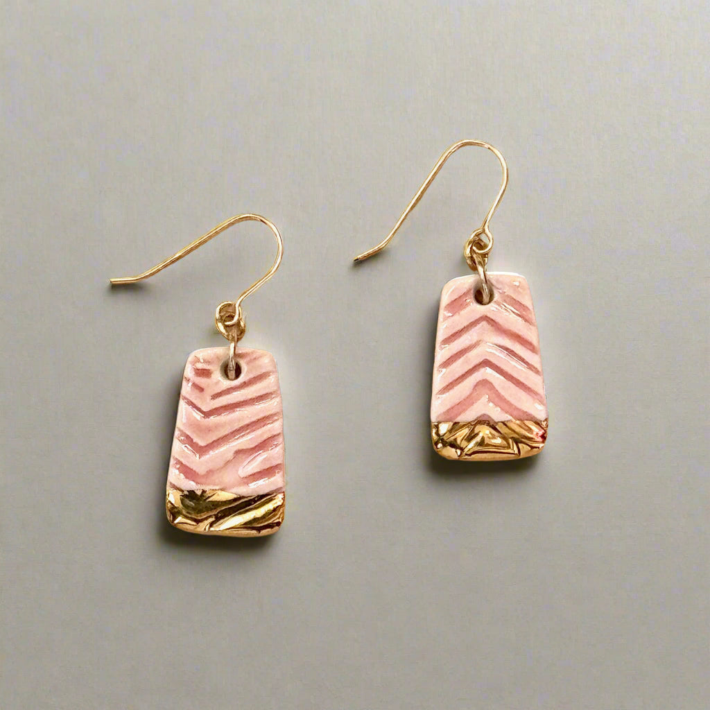 textured pink earring with gold accent