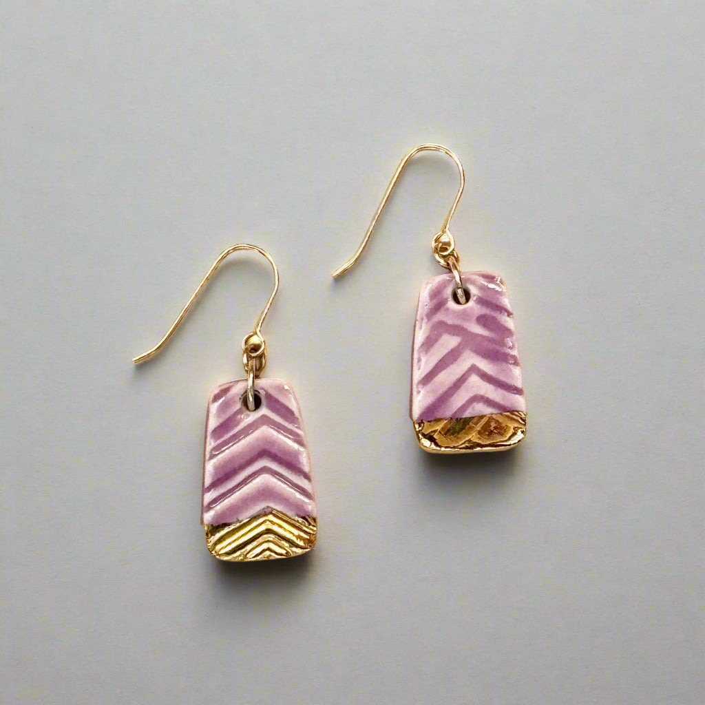 textured purple earring with gold accent