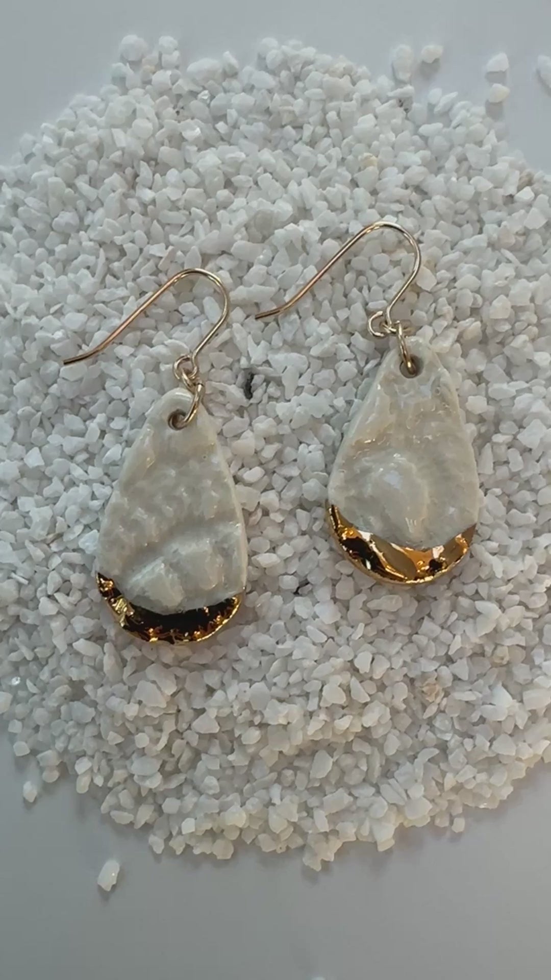 teardrop shaped, white color porcelain earrings with lace texture and gold ear wires