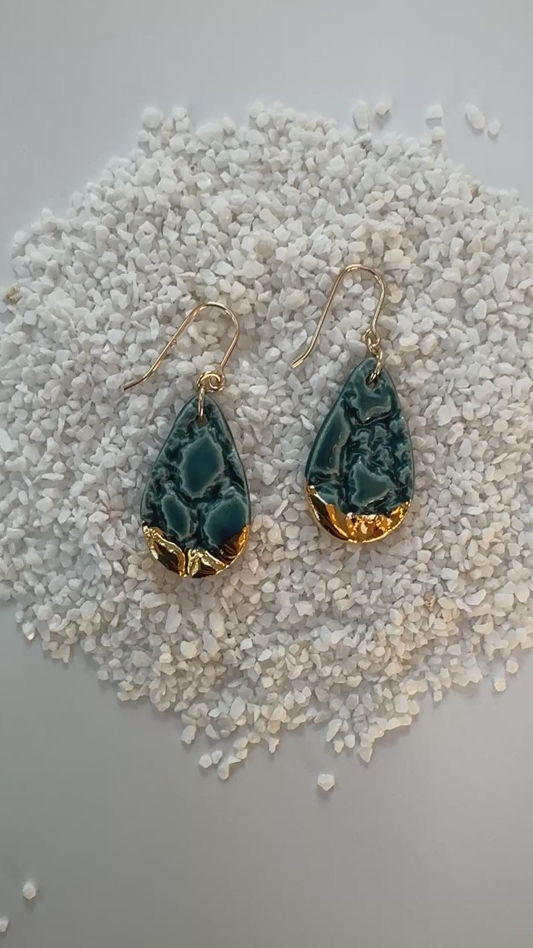 teardrop shaped, teal color porcelain earrings with lace texture and gold ear wires